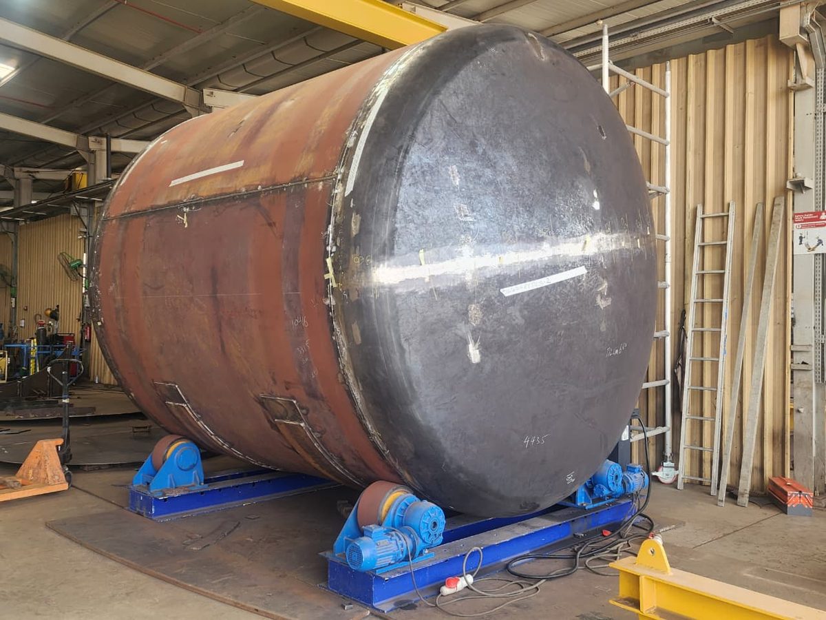 Large fabricated section on welding rollers in the shop